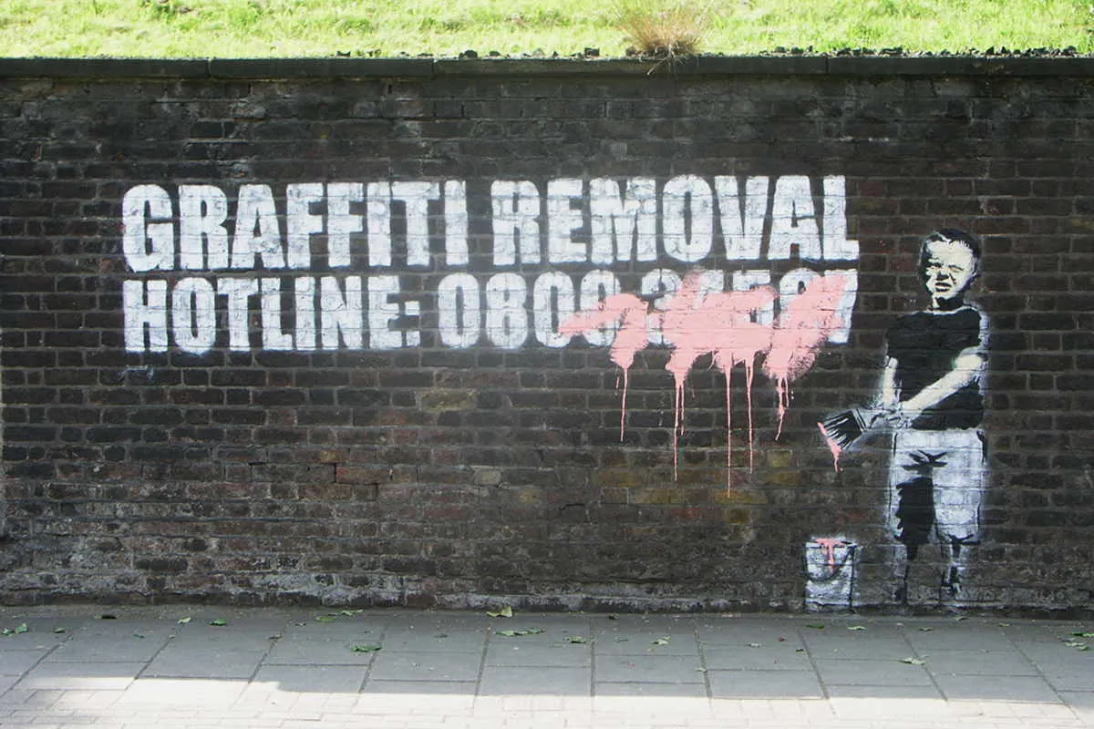 Banksy - Graffiti Hotline Boy, Pentonville Road, London, 2006