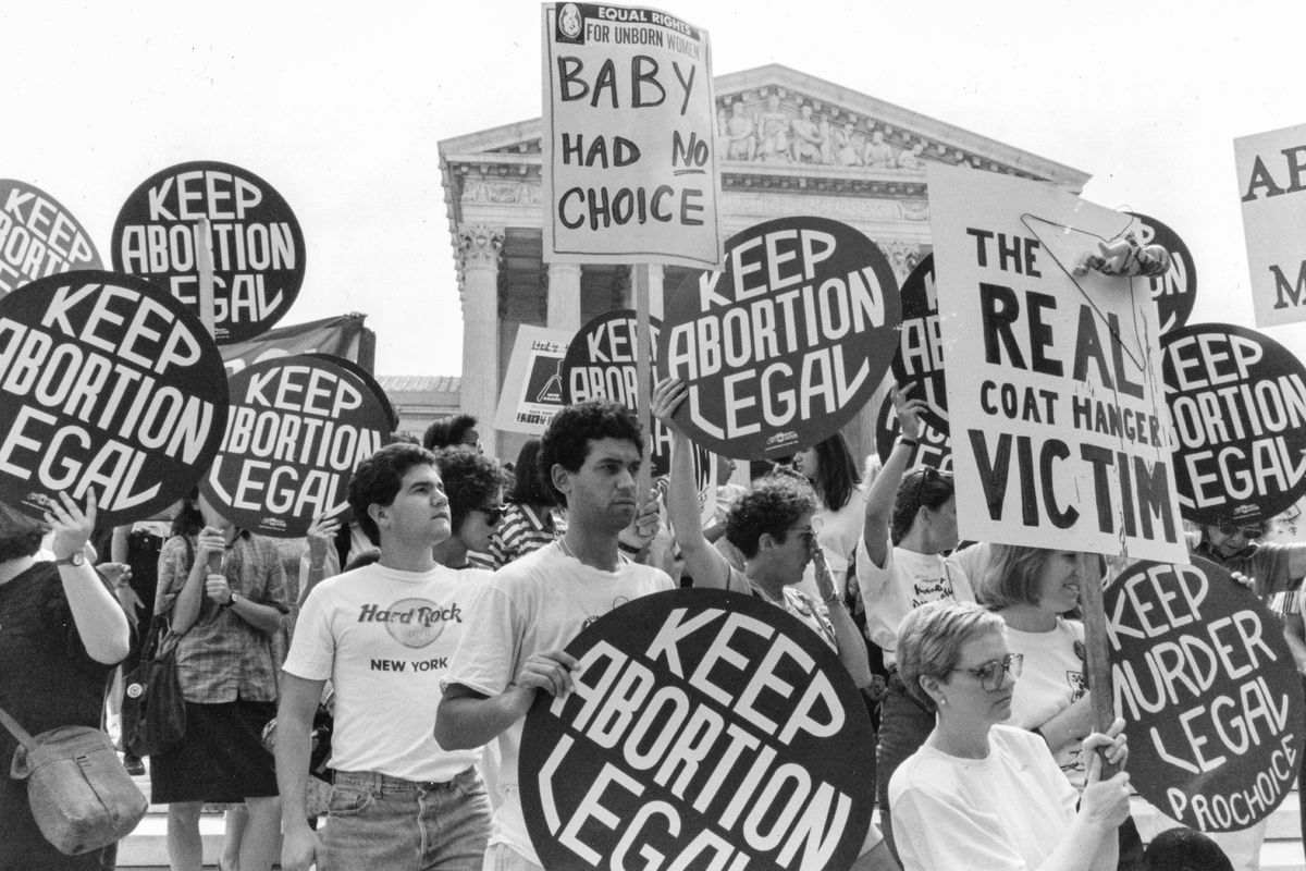 Pro-choice and anti-abortion demonstrators outside the Supreme Court in 1989, Washington DC, protesting state policy and abortion right ban, urging for legal access and health right policy